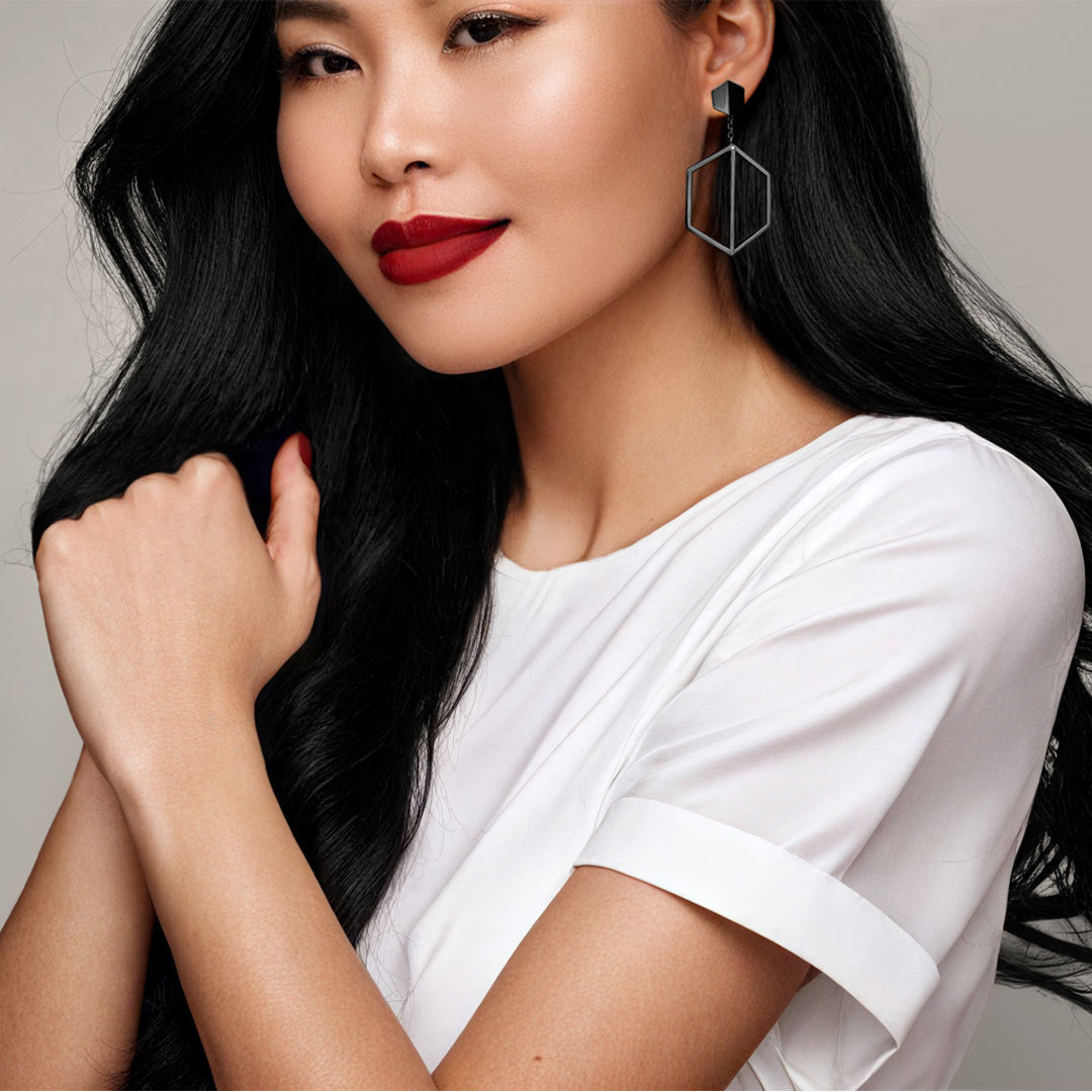 Naude Bourn's Illuminate You dangle earrings in black gold, featuring a bold and striking design that makes a dramatic statement of elegance.